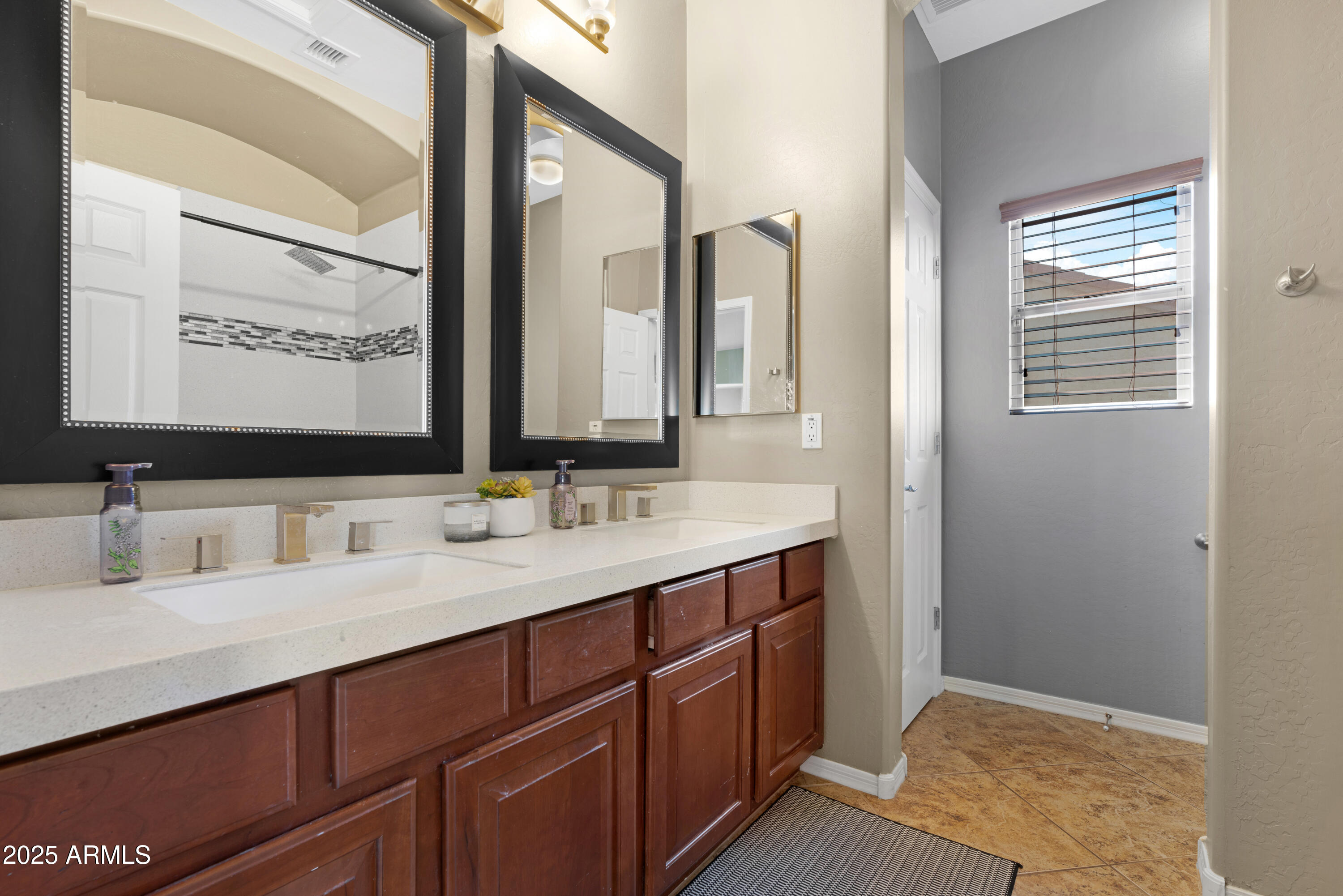 5419 West Tether Trail Phoenix, AZ 85083 - Photo 43 of 58 a bathroom with a sink and a mirror