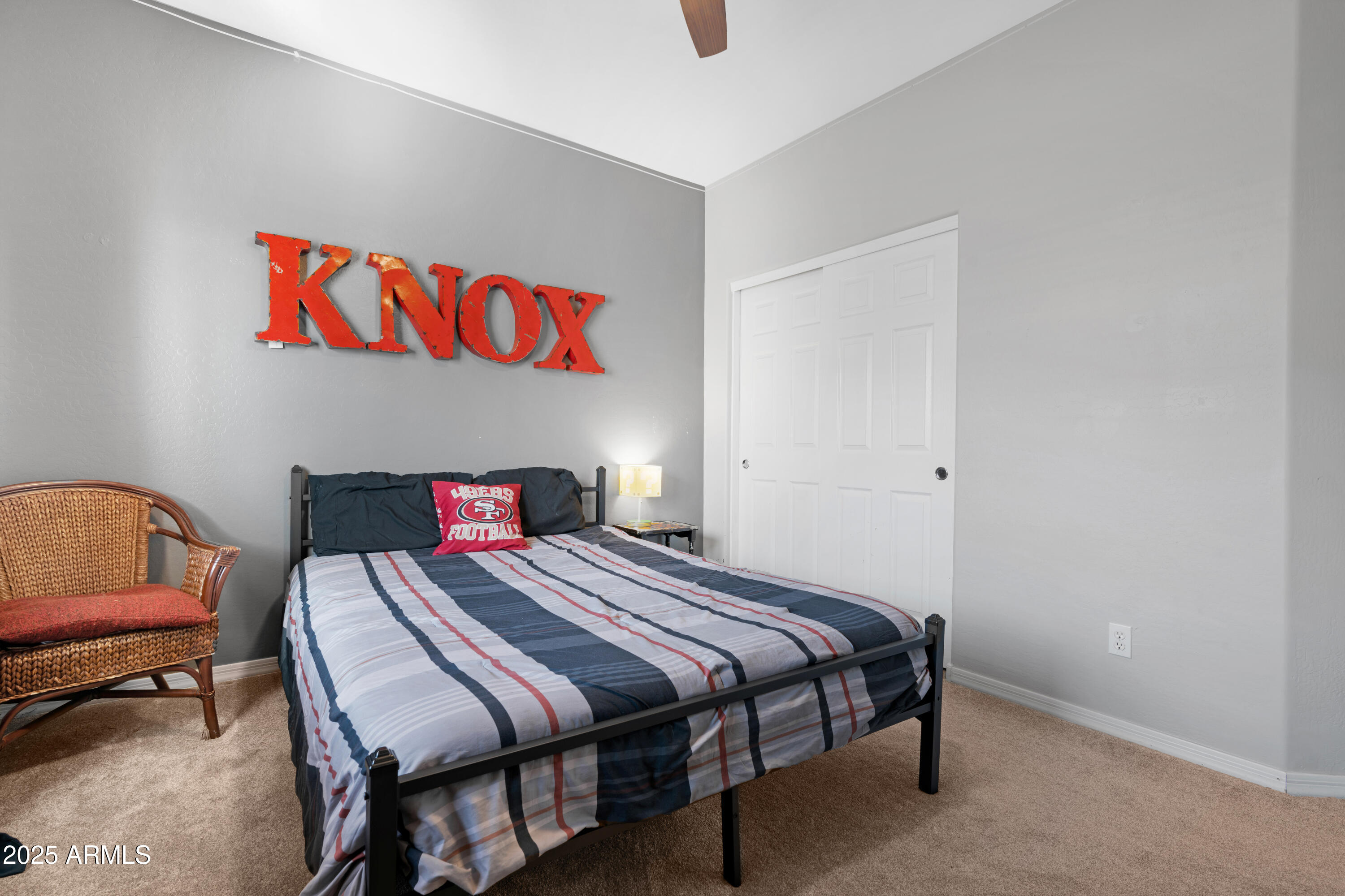 5419 West Tether Trail Phoenix, AZ 85083 - Photo 45 of 58 a bedroom with a bed a table and a couch