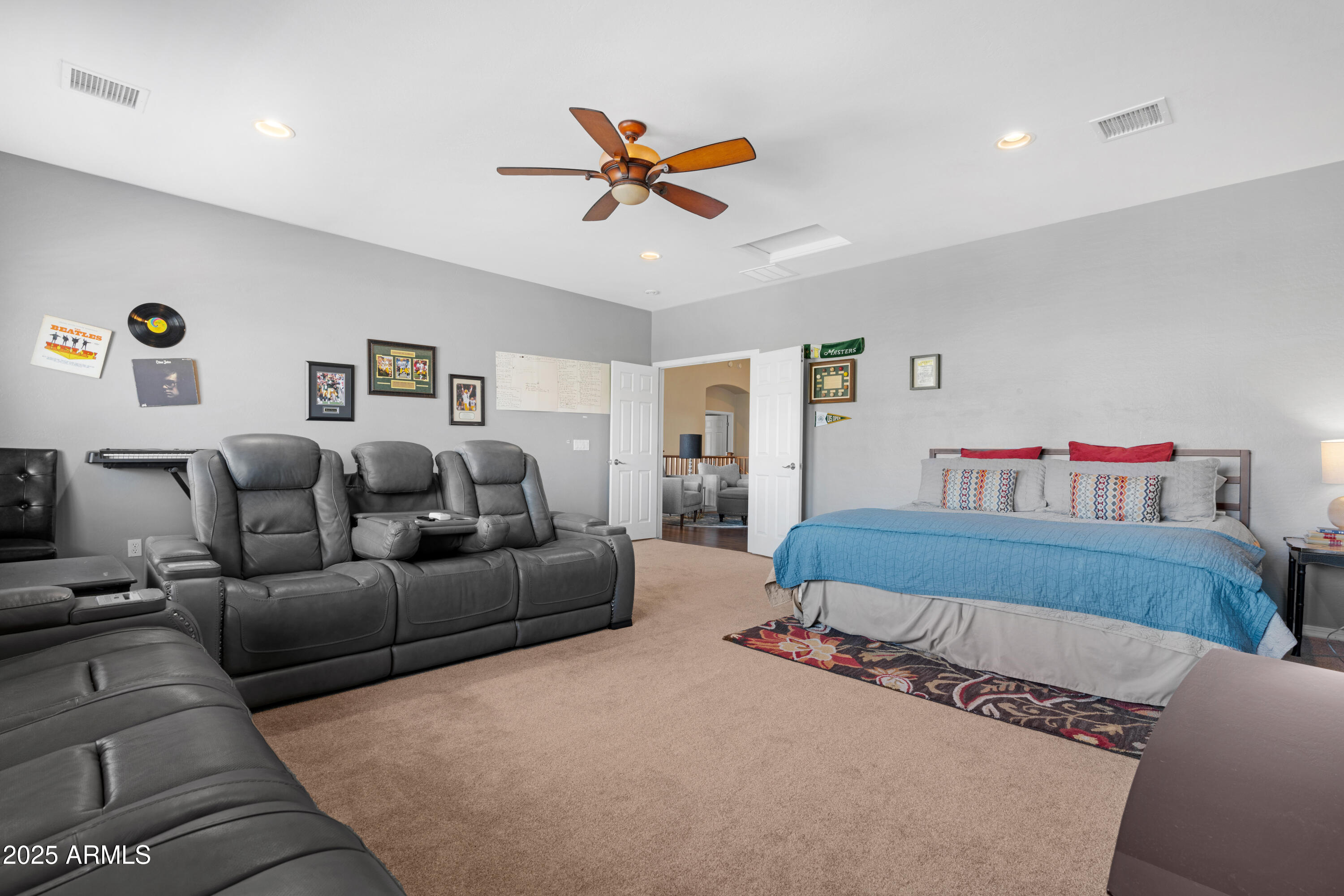 5419 West Tether Trail Phoenix, AZ 85083 - Photo 47 of 58 a bedroom with a bed and a chandelier