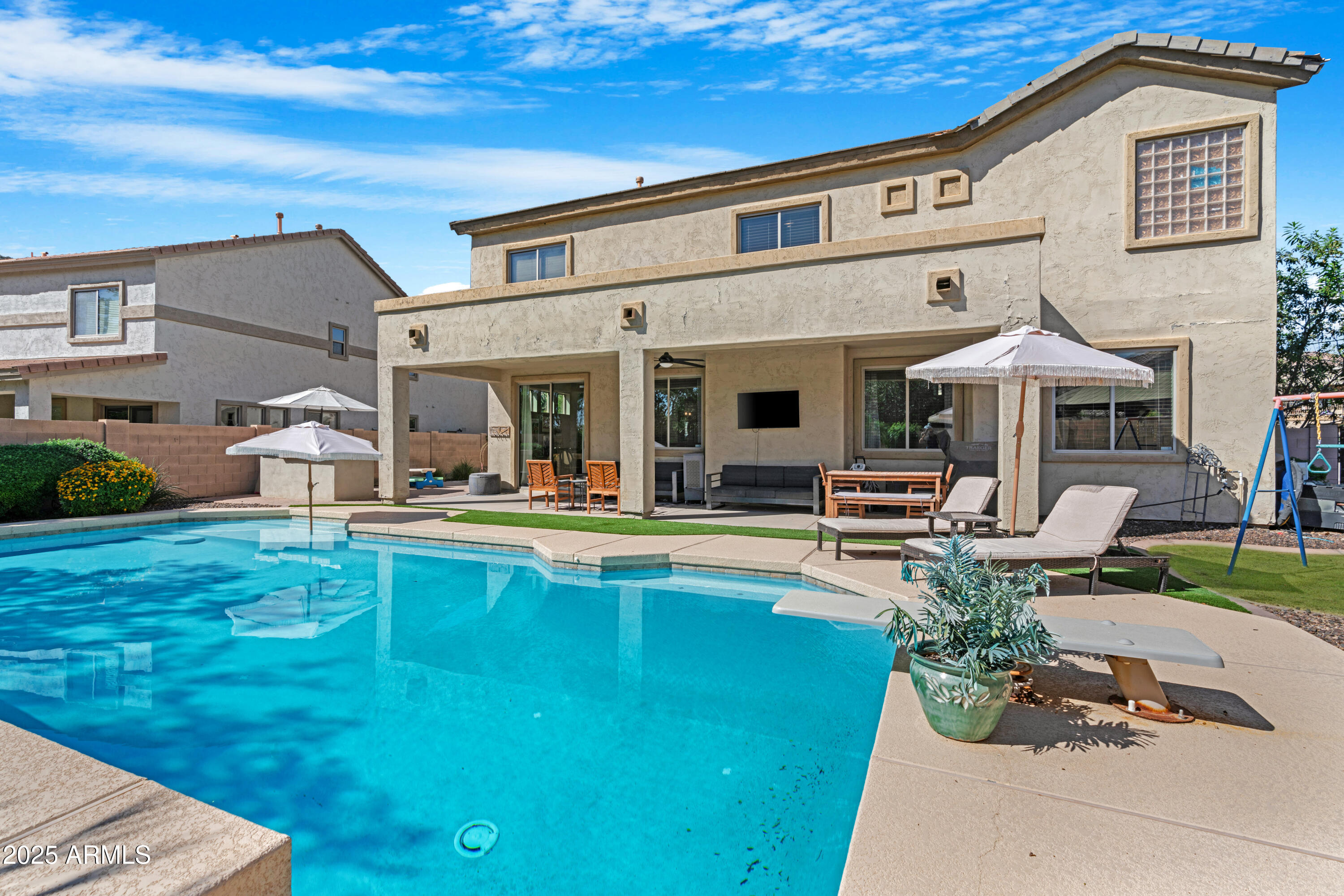 5419 West Tether Trail Phoenix, AZ 85083 - Photo 50 of 58 a view of a patio with couches table and chairs with wooden floor and fence