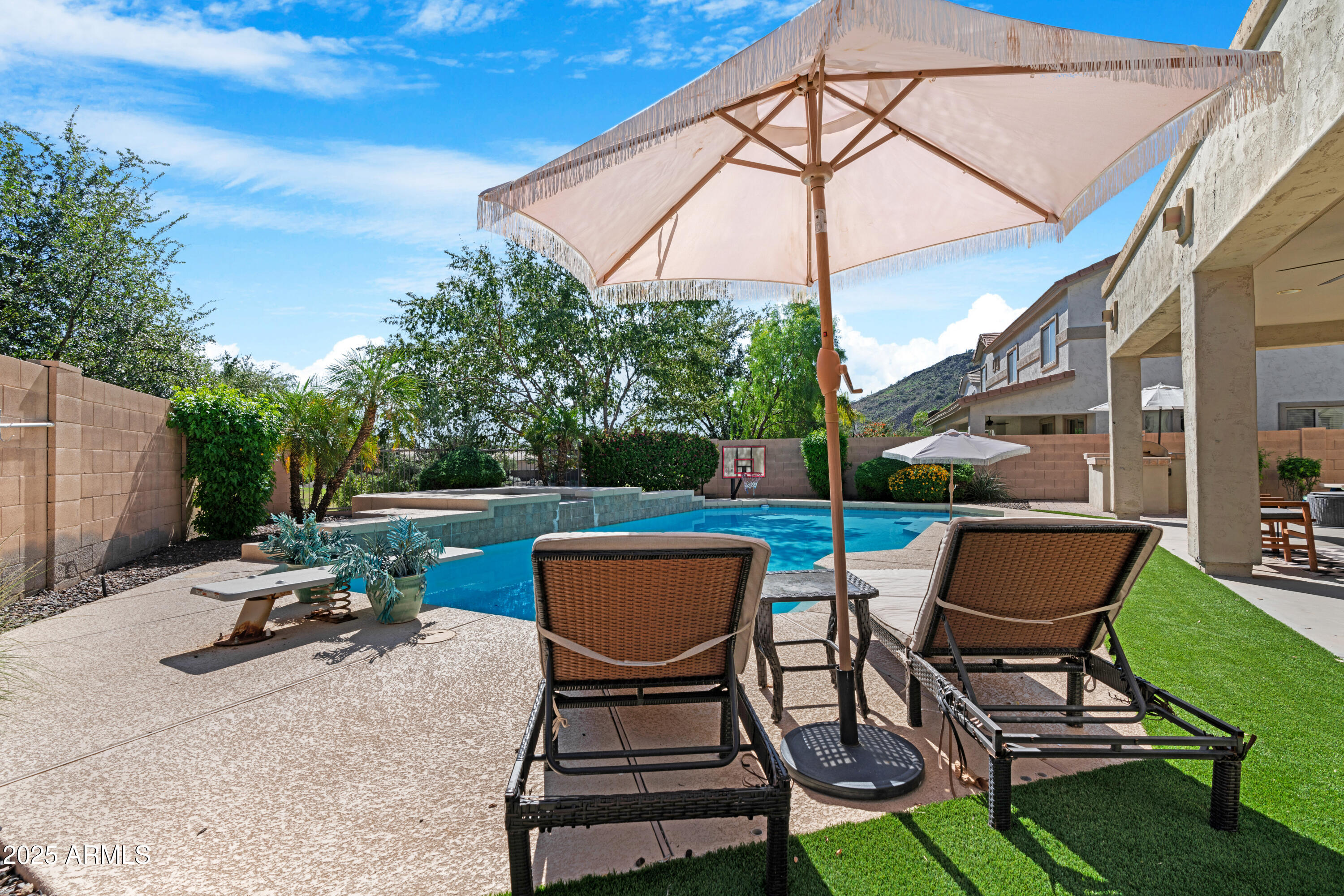 5419 West Tether Trail Phoenix, AZ 85083 - Photo 52 of 58 a view of a chairs and table in backyard