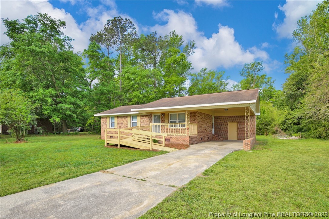 760 Horne Road Rowland, NC 28383 - Photo 3 of 30 a front view of house with yard and green space