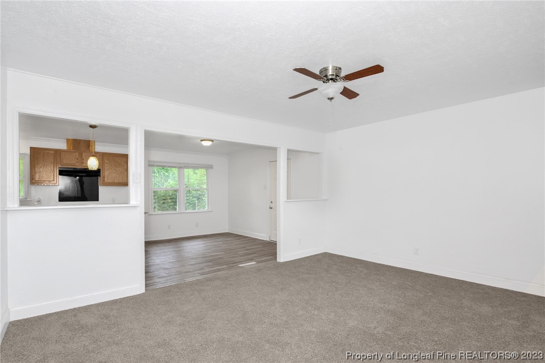 760 Horne Road Rowland, NC 28383 - Photo 9 of 30 wooden floor in an empty room with a window