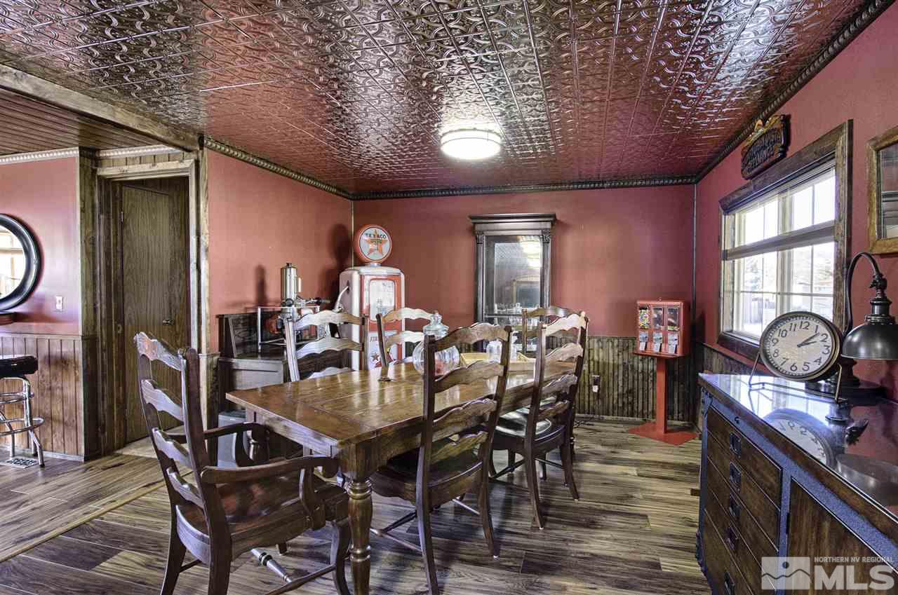 15085 Rhyolite Circle Reno, NV 89521 - Photo 8 of 23 a view of a dining room with furniture and chandelier
