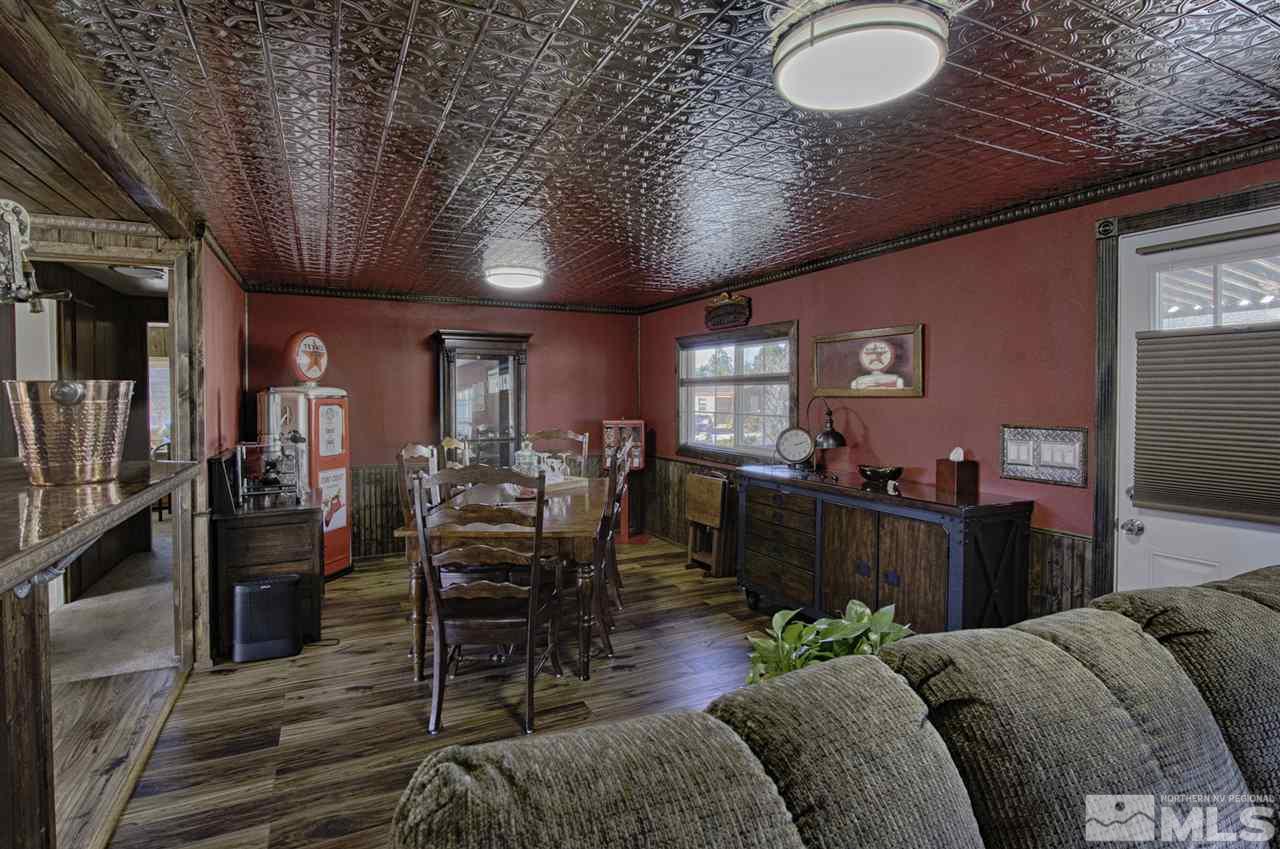 15085 Rhyolite Circle Reno, NV 89521 - Photo 10 of 23 a living room with furniture a dining table and chairs