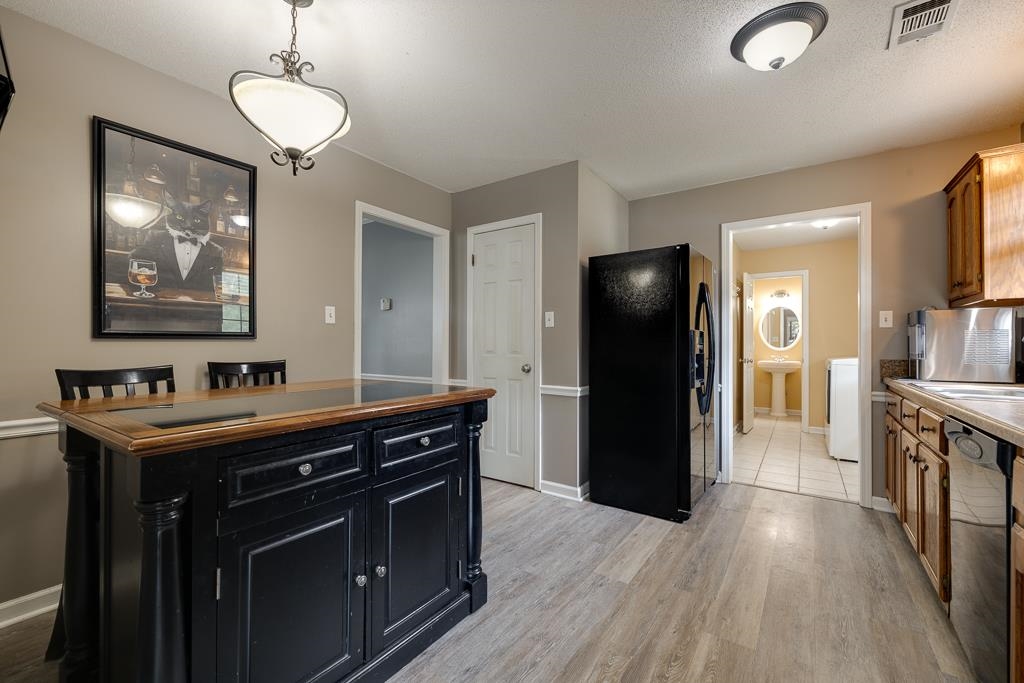 6943 Doefield Trail Bartlett, TN 38135 - Photo 11 of 32 a kitchen with a refrigerator and a sink