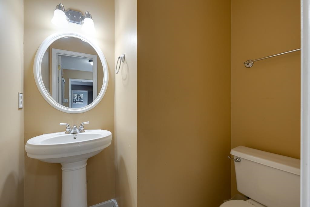 6943 Doefield Trail Bartlett, TN 38135 - Photo 16 of 32 a bathroom with a sink and a mirror