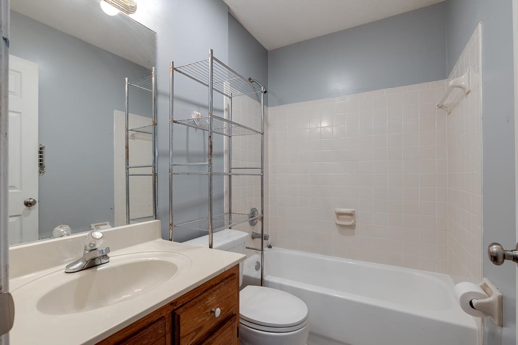 6943 Doefield Trail Bartlett, TN 38135 - Photo 26 of 32 a bathroom with a sink toilet and shower