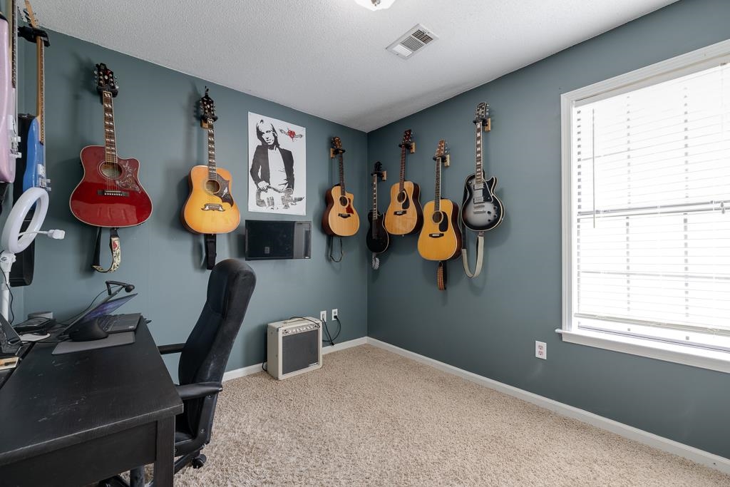 6943 Doefield Trail Bartlett, TN 38135 - Photo 27 of 32 a bedroom with a bed and a window