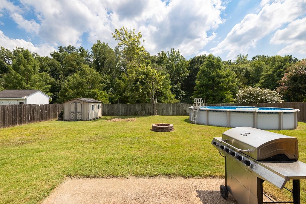 6943 Doefield Trail Bartlett, TN 38135 - Photo 30 of 32 a view of a swimming pool with a backyard
