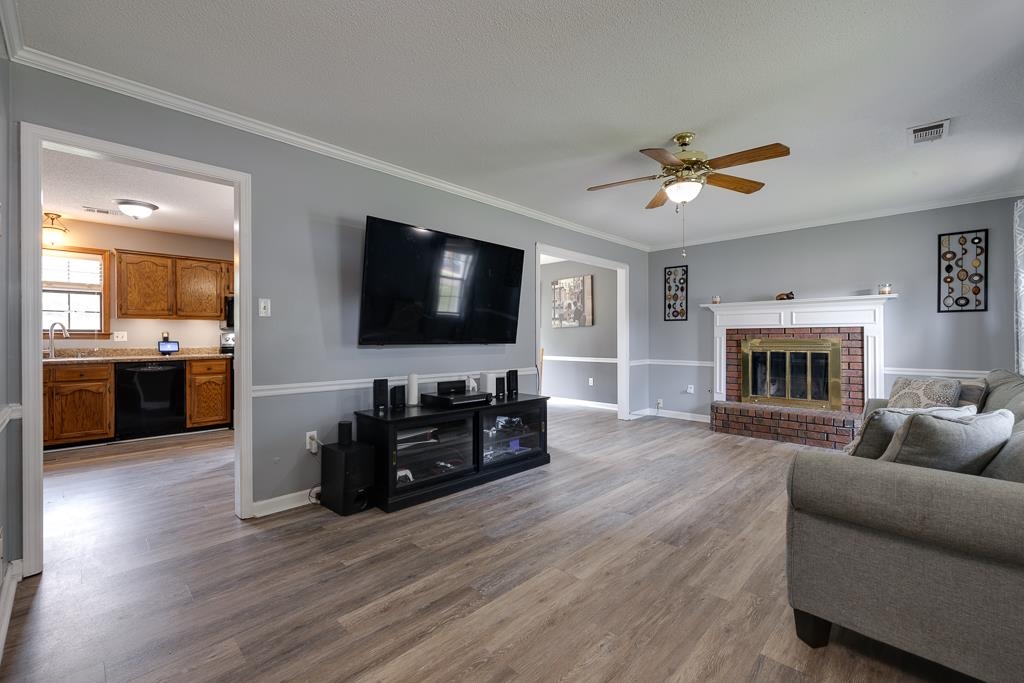 6943 Doefield Trail Bartlett, TN 38135 - Photo 3 of 32 a living room with furniture and a flat screen tv