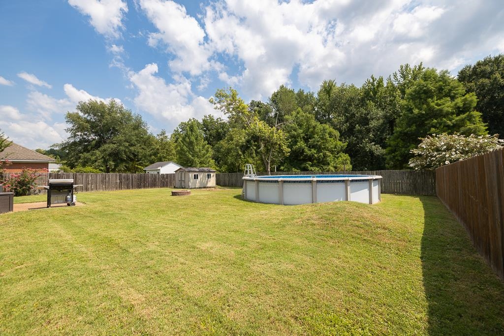 6943 Doefield Trail Bartlett, TN 38135 - Photo 32 of 32 a swimming pool with trees in the background