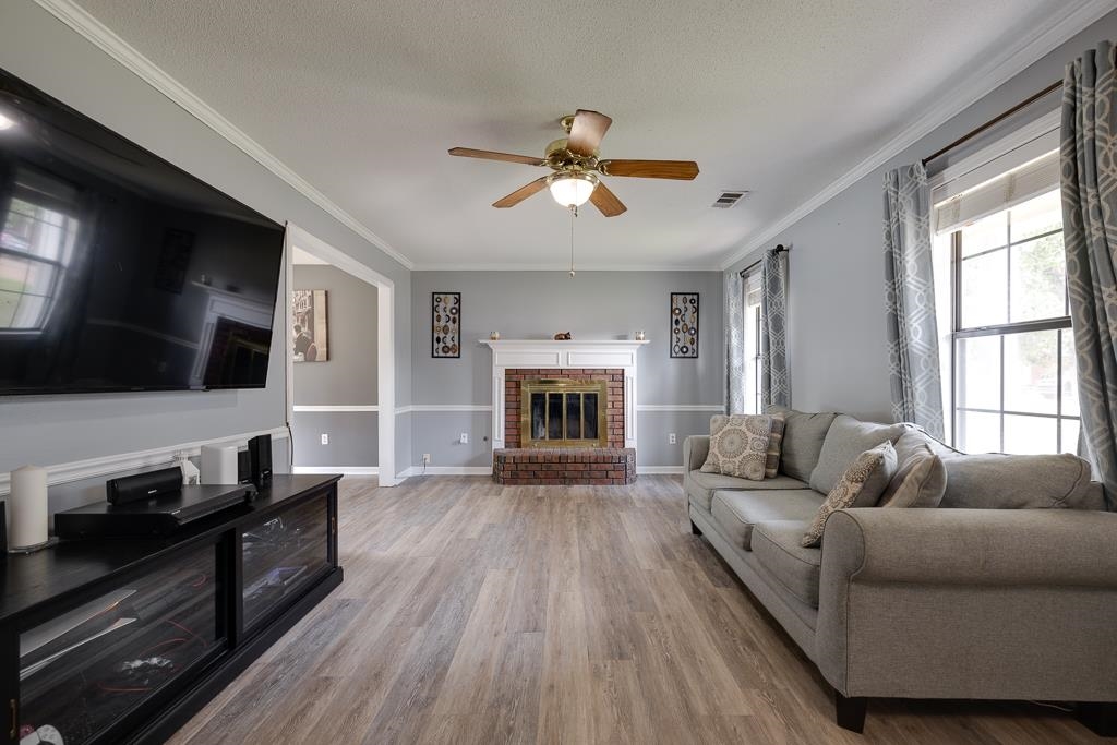 6943 Doefield Trail Bartlett, TN 38135 - Photo 4 of 32 a living room with furniture fireplace and flat screen tv
