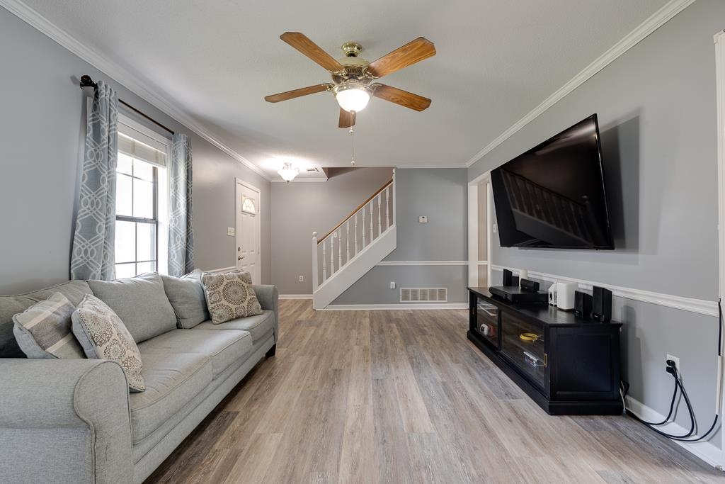6943 Doefield Trail Bartlett, TN 38135 - Photo 5 of 32 a living room with furniture and a flat screen tv