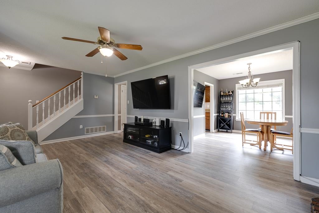 6943 Doefield Trail Bartlett, TN 38135 - Photo 6 of 32 a living room with furniture and a flat screen tv