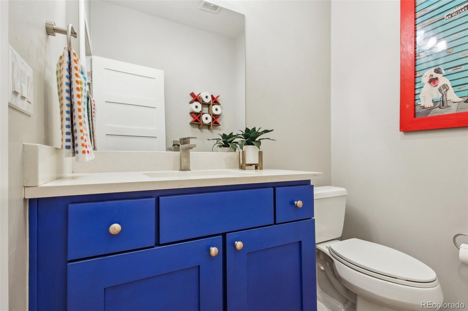 4132 Stuart Street Denver, CO 80212 - Photo 15 of 35 a bathroom with a sink vanity and toilet