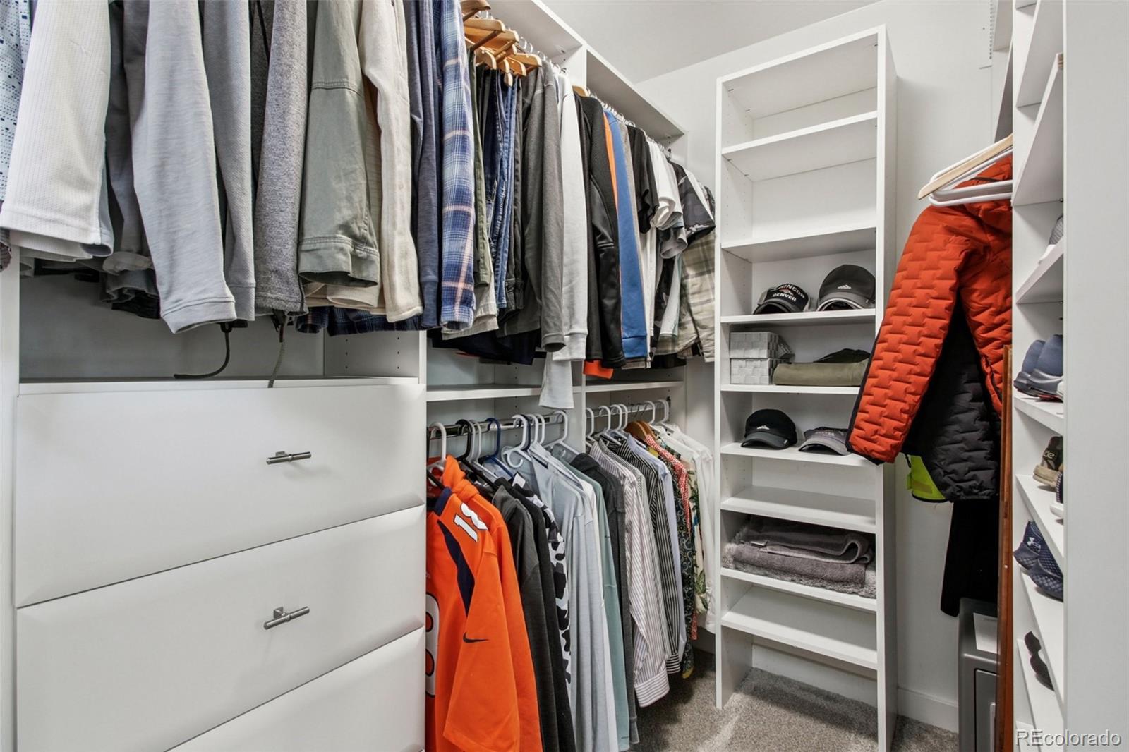 4132 Stuart Street Denver, CO 80212 - Photo 21 of 35 a view of walk in closet with clothes and shoes
