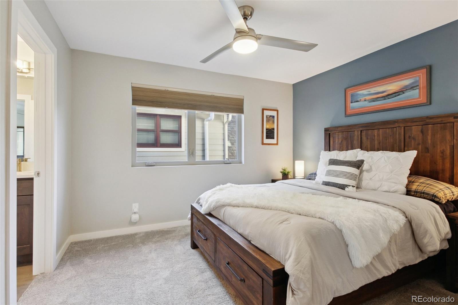 4132 Stuart Street Denver, CO 80212 - Photo 22 of 35 a bedroom with bed and window