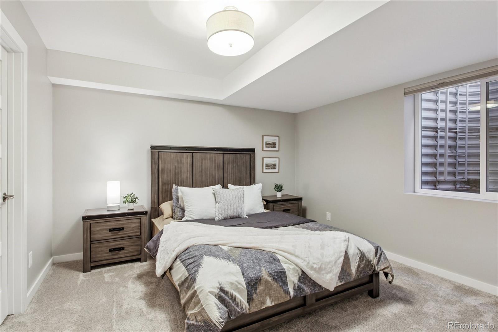 4132 Stuart Street Denver, CO 80212 - Photo 32 of 35 a bedroom with a bed and a window