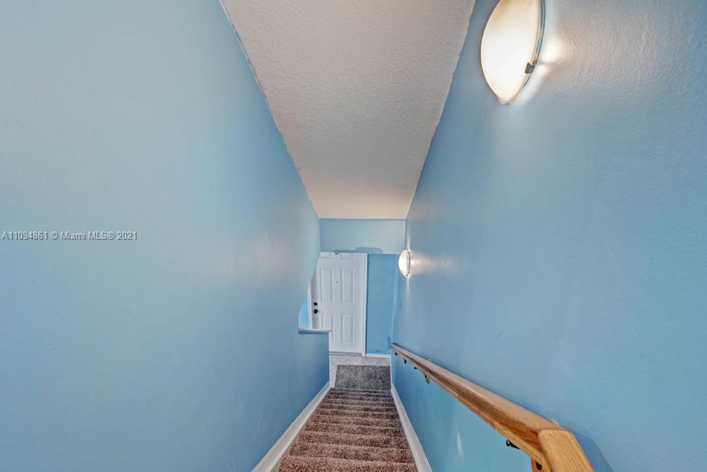 1541 Frederick Small Road, Unit 1541 Jupiter, FL 33458 - Photo 13 of 56 a view of a hallway with wooden floor
