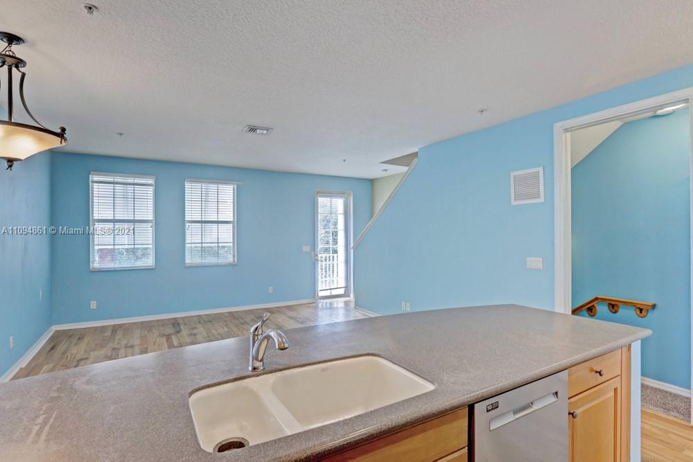 1541 Frederick Small Road, Unit 1541 Jupiter, FL 33458 - Photo 25 of 56 a bathroom with a sink and a mirror