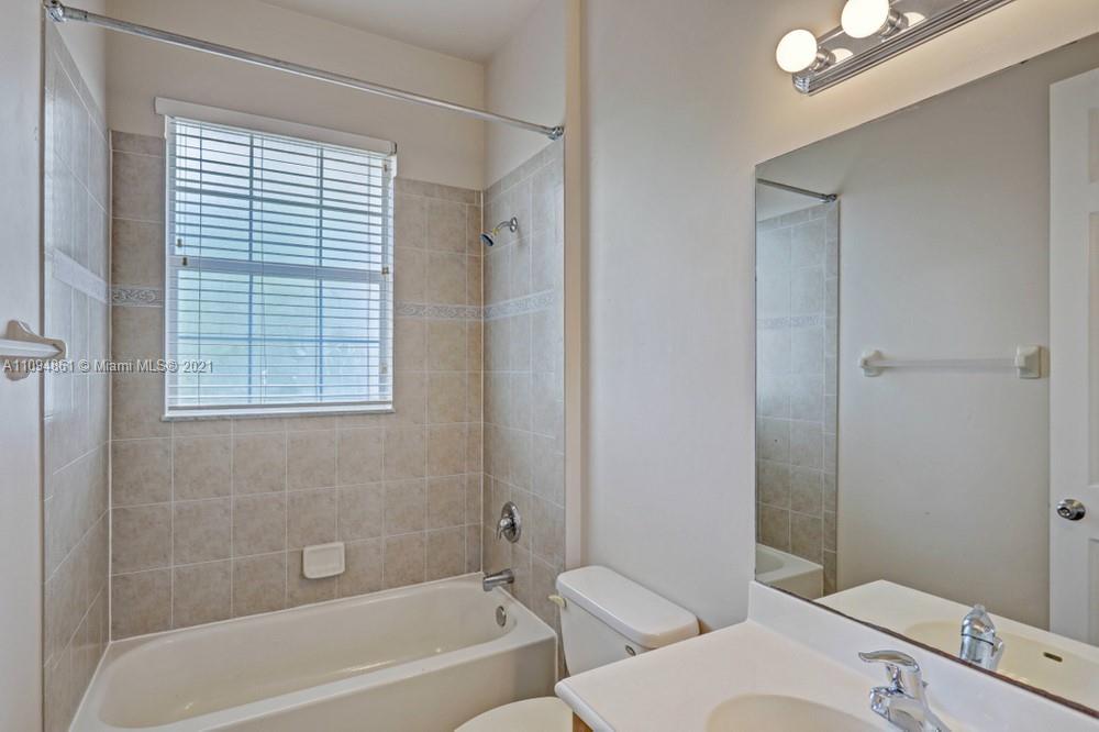 1541 Frederick Small Road, Unit 1541 Jupiter, FL 33458 - Photo 38 of 56 a bathroom with a window and a toilet