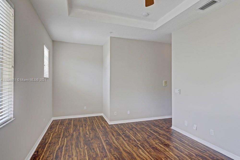 1541 Frederick Small Road, Unit 1541 Jupiter, FL 33458 - Photo 42 of 56 a view of a room with wooden floor and brick walls