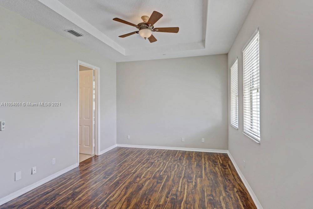 1541 Frederick Small Road, Unit 1541 Jupiter, FL 33458 - Photo 44 of 56 wooden floor in an empty room with a window