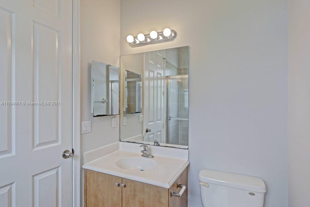 1541 Frederick Small Road, Unit 1541 Jupiter, FL 33458 - Photo 45 of 56 a bathroom with a sink a toilet and shower