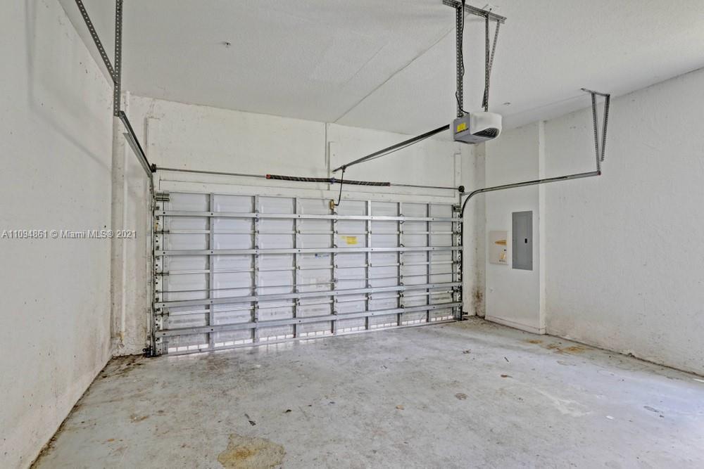 1541 Frederick Small Road, Unit 1541 Jupiter, FL 33458 - Photo 48 of 56 a view of a garage