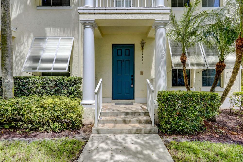 1541 Frederick Small Road, Unit 1541 Jupiter, FL 33458 - Photo 5 of 56 a front view of a house with a yard