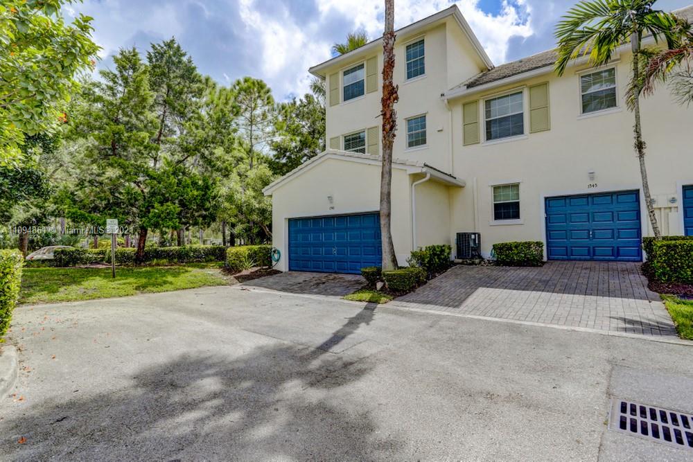 1541 Frederick Small Road, Unit 1541 Jupiter, FL 33458 - Photo 55 of 56 a house with yard and a trees
