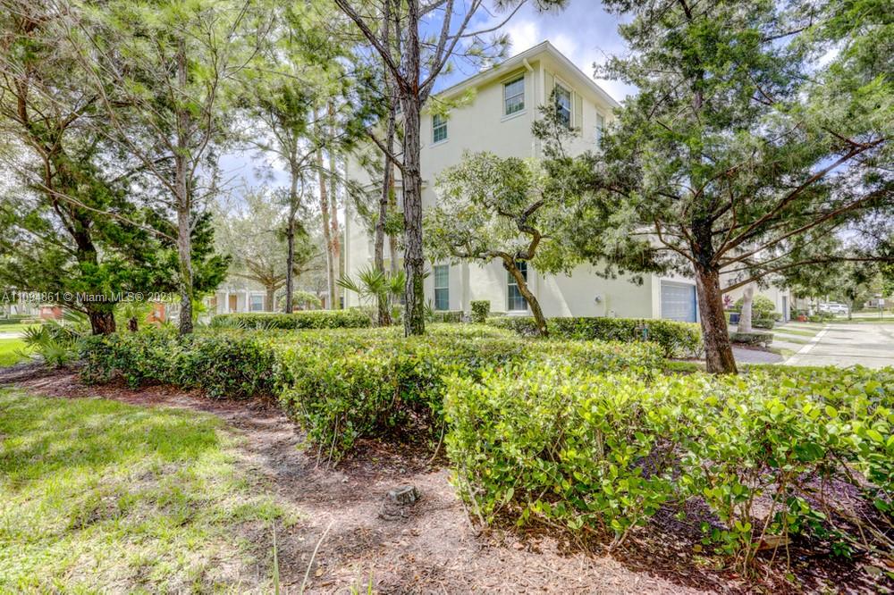 1541 Frederick Small Road, Unit 1541 Jupiter, FL 33458 - Photo 56 of 56 a view of a garden with large trees