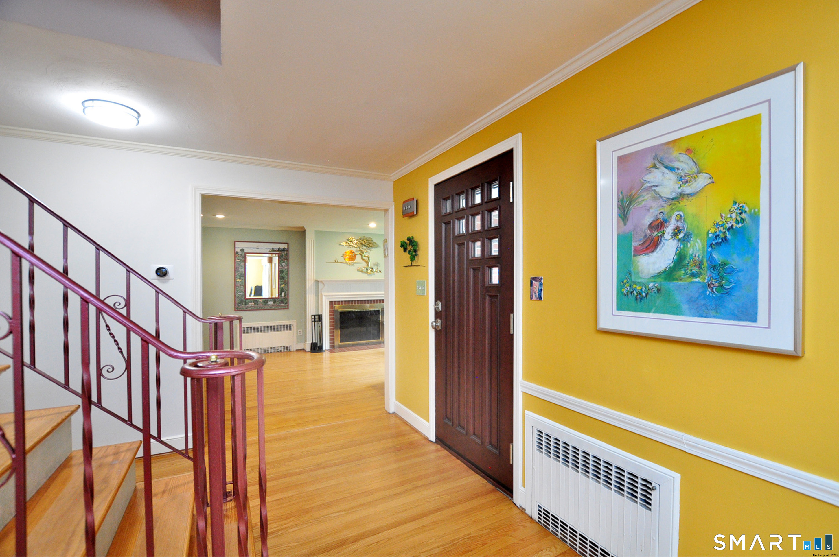44 Miamis Road West Hartford, CT 06117 - Photo 3 of 39 a view of a hallway with wooden floor and dining room