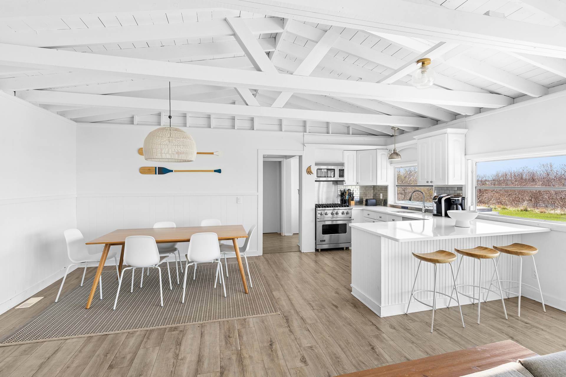 351 East Lake Drive Montauk, NY 11954 - Photo 5 of 30 a view of a dining room with furniture and wooden floor