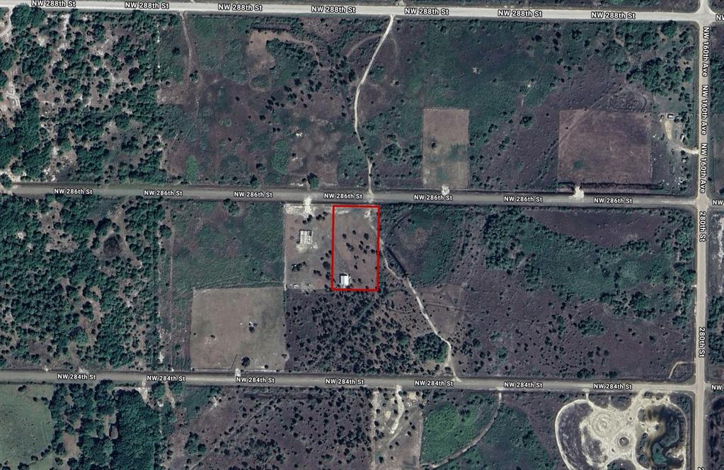 16382 Northwest 286th Street Okeechobee, FL 34972 - Photo 2 of 6 a bird view of a house