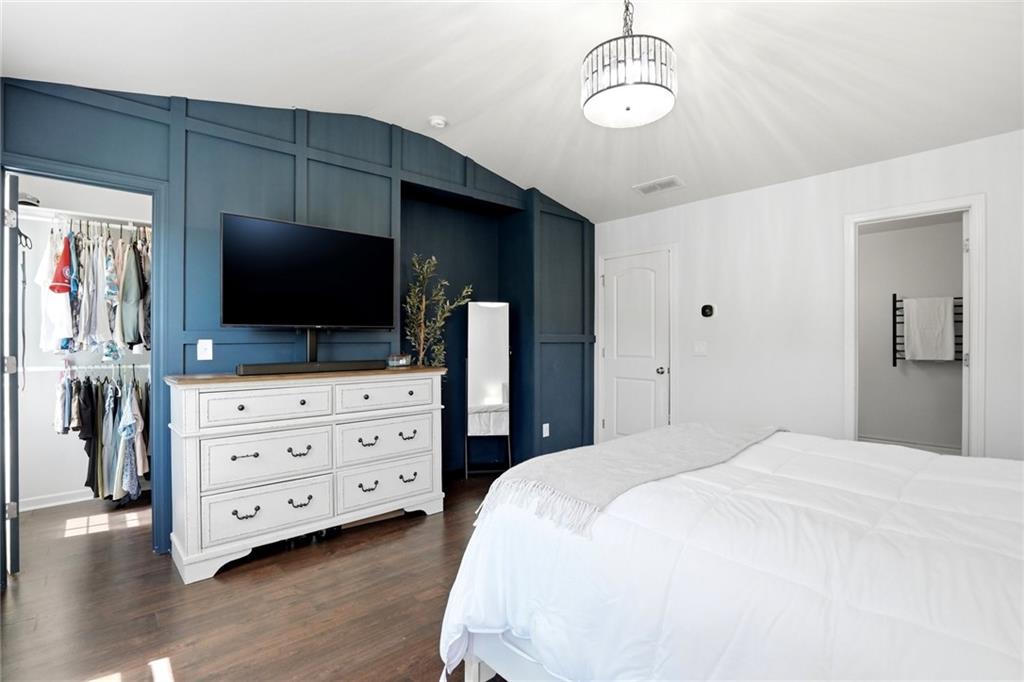 244 Sidney Lanier Avenue Athens, GA 30607 - Photo 16 of 32 a bedroom with a bed and flat screen tv