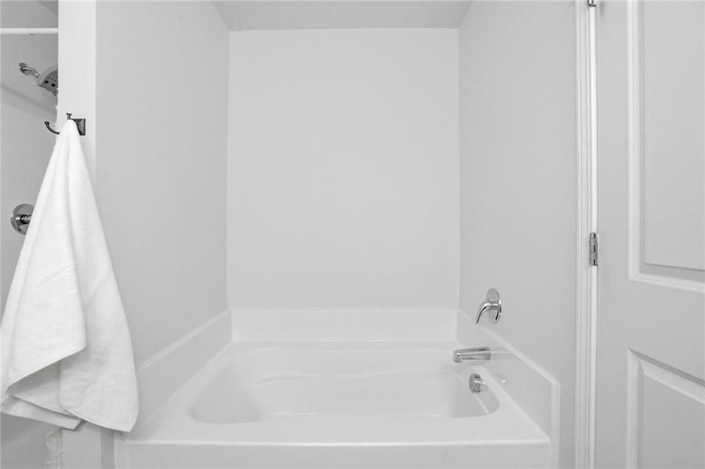 244 Sidney Lanier Avenue Athens, GA 30607 - Photo 18 of 32 a white bath tub sitting next to a white sink
