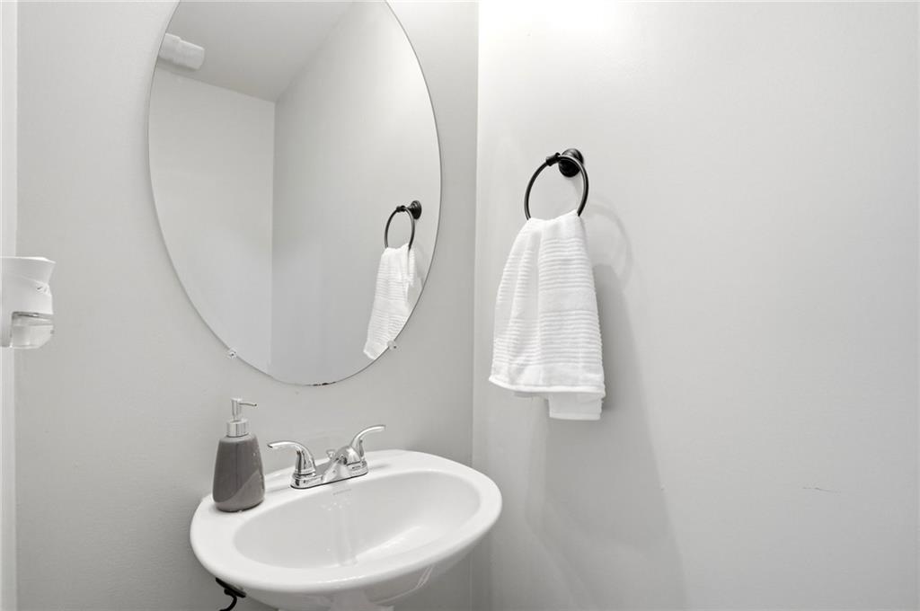 244 Sidney Lanier Avenue Athens, GA 30607 - Photo 24 of 32 a bathroom with a sink and mirror