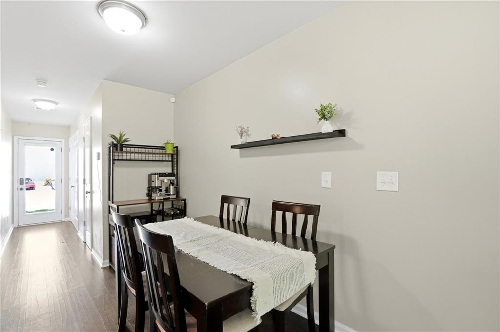 244 Sidney Lanier Avenue Athens, GA 30607 - Photo 7 of 32 a view of a dining room with furniture and wooden floor