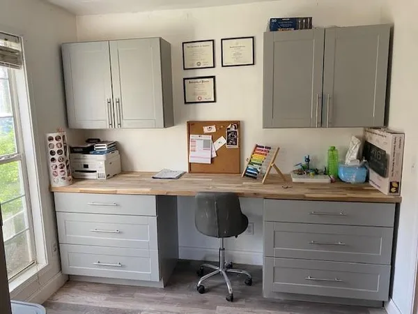 a kitchen with cabinets appliances and a counter top space