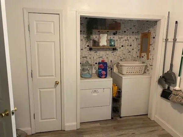 a kitchen with a refrigerator and cabinets