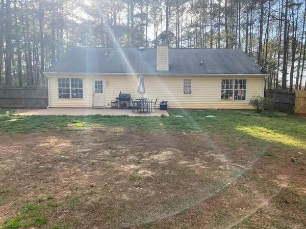 a view of a house with a back yard