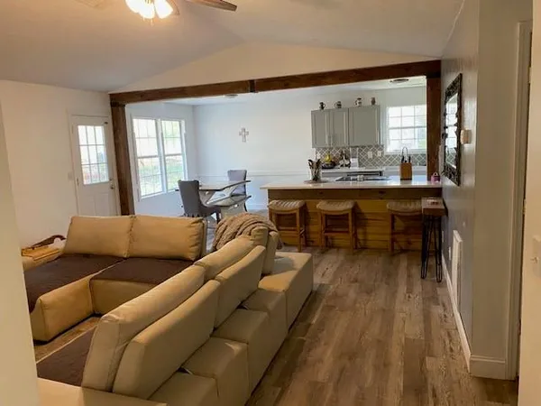 a living room with furniture and a large window