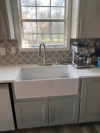 a room with a window and a sink