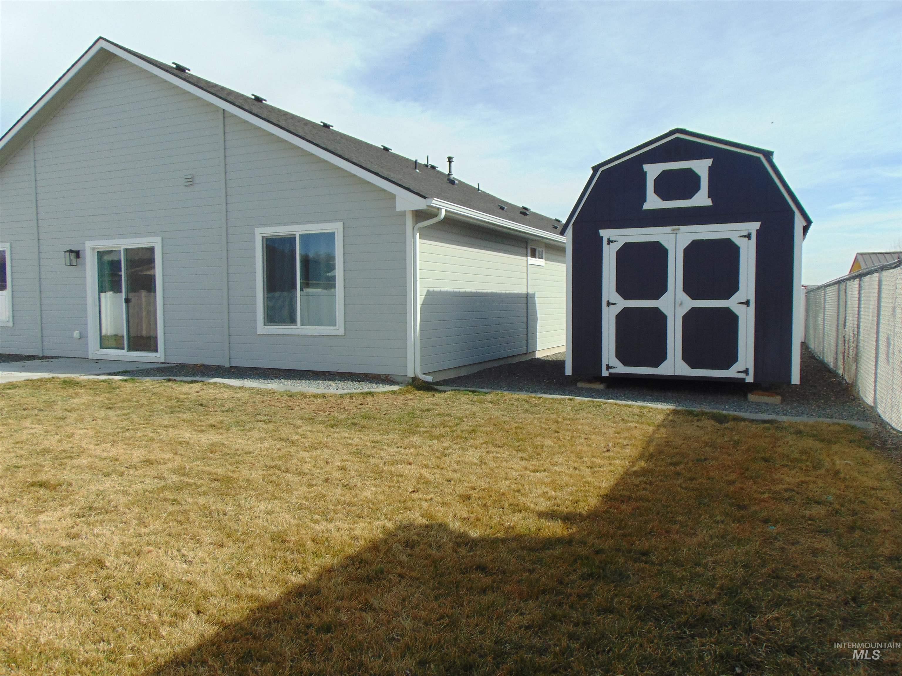 901 Campbell Street Vale, OR 97918 - Photo 18 of 22 Rear view of property with a storage unit