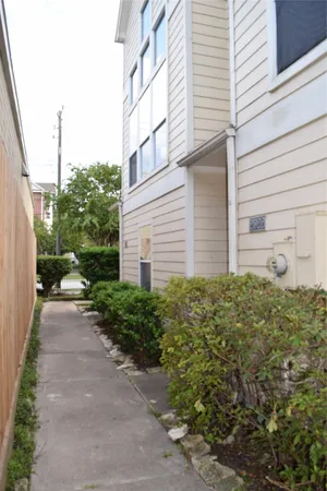 a view of a garage door and a window