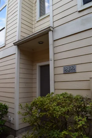 a view of front door and potted plants