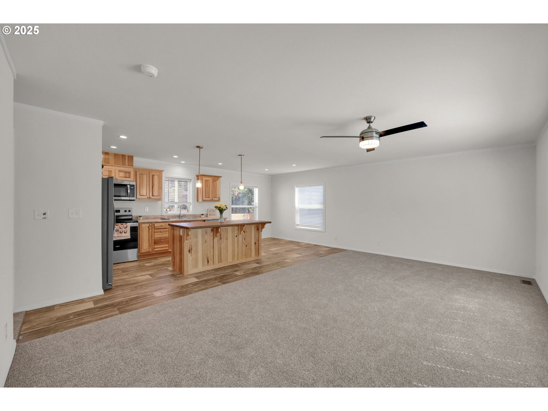 498 Moffit Lane Springfield, OR 97477 - Photo 3 of 24 a living room with stainless steel appliances kitchen island furniture and a kitchen view