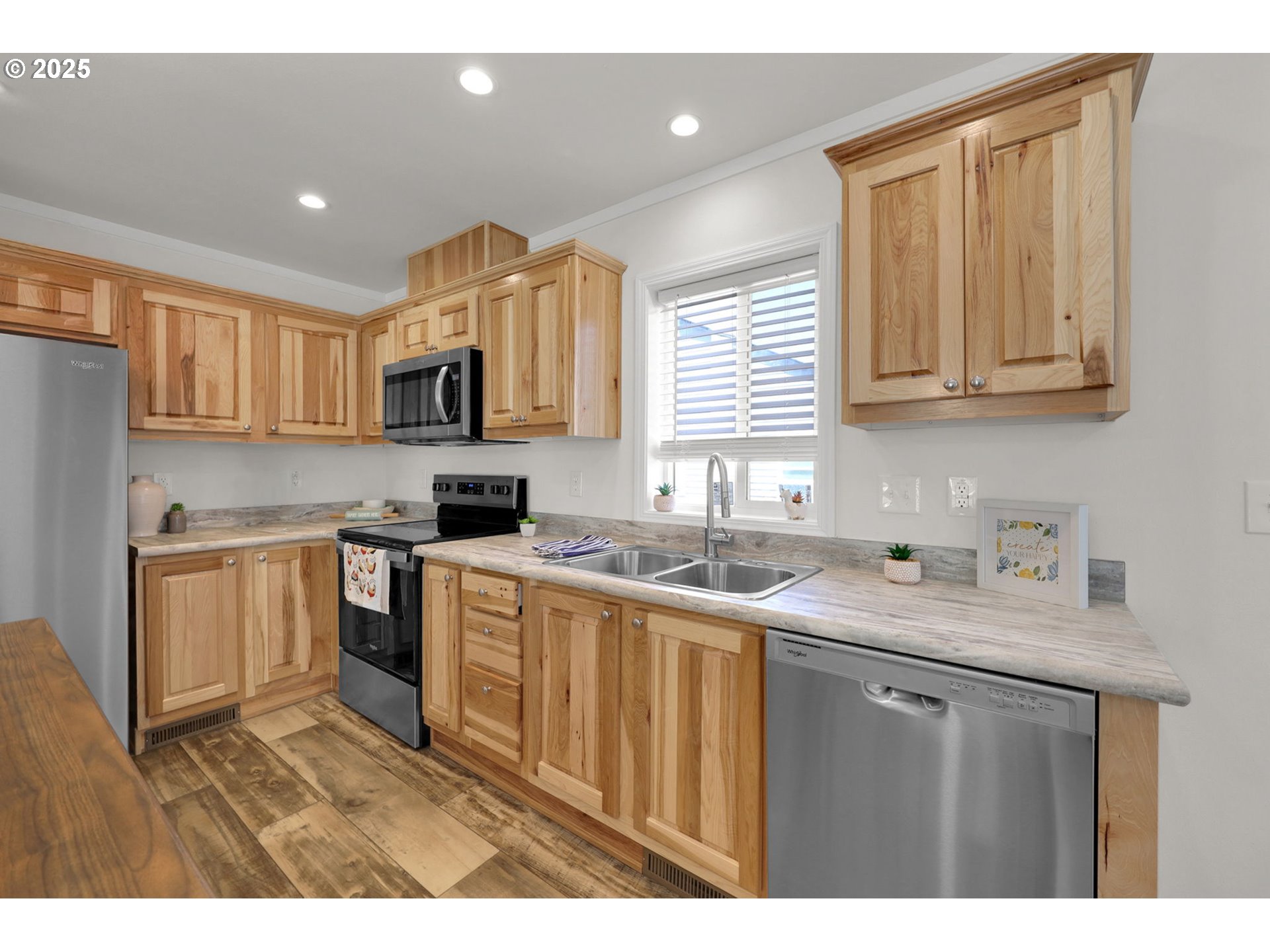 498 Moffit Lane Springfield, OR 97477 - Photo 5 of 24 a kitchen with kitchen island granite countertop a sink cabinets and stainless steel appliances